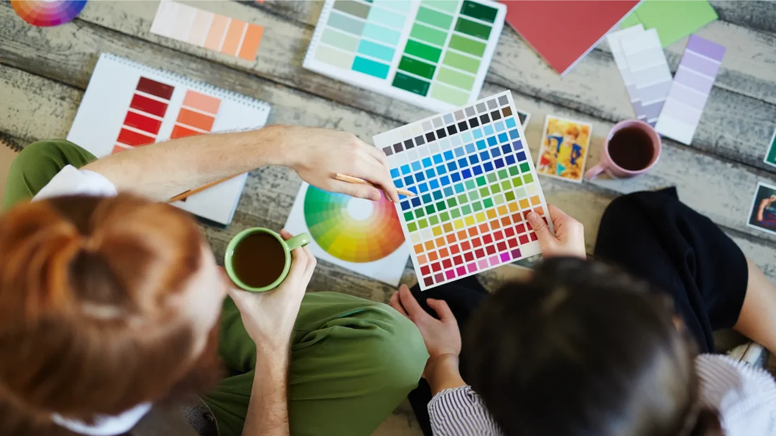 Woman checking out the pantone range of colors